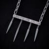 a stainless steel necklace made from the handle and fork tines of a vintage fork.
