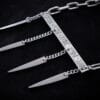 a stainless steel necklace made from the handle and fork tines of a vintage fork.